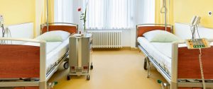 A room in the hospital with hospital bed and a sofa. Hospital flooring by All Floor Commercial's. They provide commercial flooring across across Connecticut